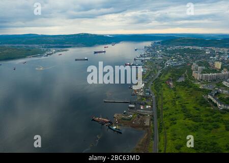 Murmansk, Russia - August 18, 2019: The coast of Kola Bay in the port of Murmansk. Shooting from above drone. Stock Photo
