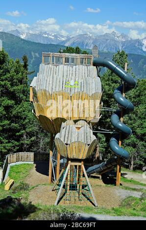 Jerzens, Austria - June 24th 2016: Zirbenpark, preferred playground and lookout with spiral slide in hiking area Hochzeiger mountain Stock Photo