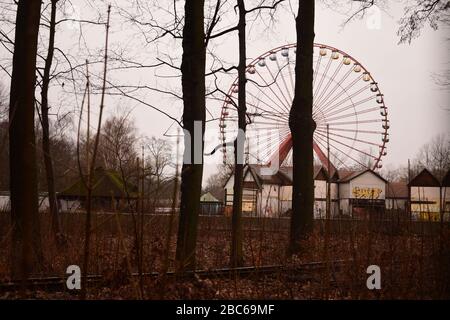 Abandoned ferris wheel in spreepark planterwald in former east Berlin Stock Photo