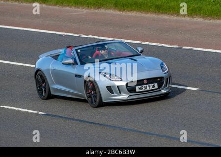 2017 silver Jaguar F-Type S V6 Auto; Vehicular traffic moving vehicles, driving vehicle on UK roads, motors, motoring on the M6 motorway highway Stock Photo