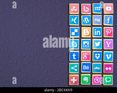 PORT ELIZABETH, EASTERN CAPE, SOUTH AFRICA - APRIL 02, 2020:  Social media logotype icons popular collection printed and place on wood toy blocks isol Stock Photo