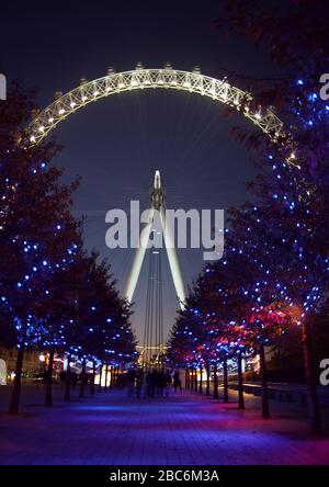 The London Eye at night. The 'Eye' is a giant Ferris wheel located on the south bank of the river Thames, Its also known as the Millennium Wheel. Stock Photo