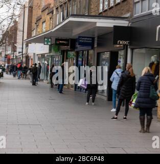 Brentwood Essex, UK. 3rd Apr, 2020. Larger numbers of cars and pedestrians in Brentwood High Street. during the covid lockdown. In particular large lines outside retail banks Credit: Ian Davidson/Alamy Live News Stock Photo