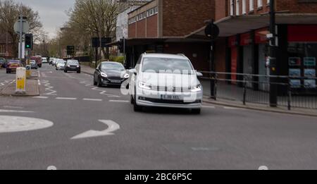 Brentwood Essex, UK. 3rd Apr, 2020. Larger numbers of cars and pedestrians in Brentwood High Street. during the covid lockdown. In particular large lines outside retail banks Credit: Ian Davidson/Alamy Live News Stock Photo