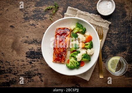 Steam salmon and vegetables, Paleo, keto, fodmap, dash diet. Mediterranean food with steamed fish. Stock Photo