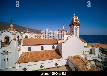 View of the church Basilica of Our Lady of Candelaria, the town in the distance Stock Photo