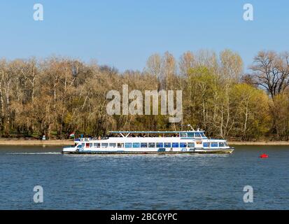 Tourist boat on Szentendre branch of Danube River on sunny day. Stock Photo