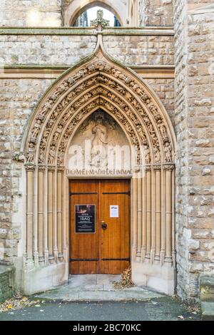 The Mount Street Gardens entrance to the Church of the Immaculate Conception (1849), Farm Street, Roman Catholic parish church in Mayfair, London, UK. Stock Photo