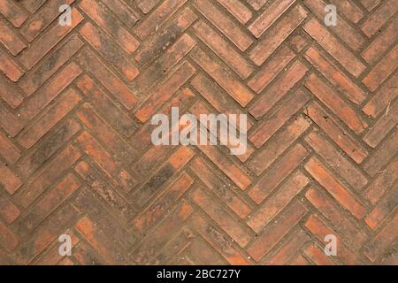 Brick wall and floor, zigzag pattern, abstract and background, in orange brown color. Stock Photo