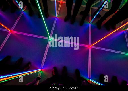 Inside the attraction "Mirror Maze" with LED multi-colored backlight. Stock Photo