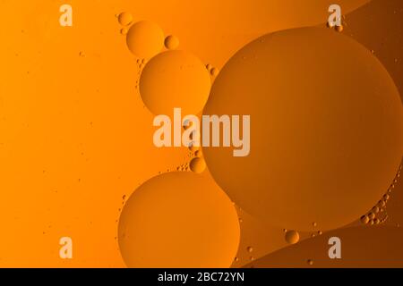 Abstract background from mixed water and oil bubbles , yellow color Stock Photo