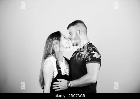 Romantic kiss. Trust and support. Cute and sweet relationship is dream for every girl in world. Couple in love. Couple goals concept. Man and woman beige background. Family love. Couple flirting. Stock Photo