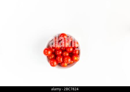 Italian red tomatoes close up food with pasta, basil leafs, cheese, isolated on white background - Top view Stock Photo