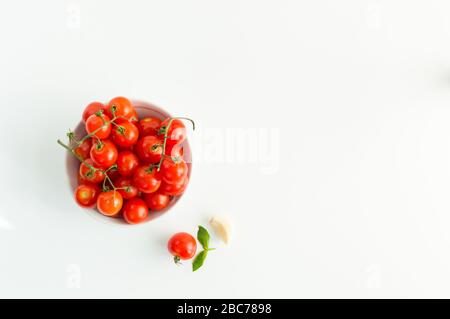 Italian red tomatoes close up food with pasta, basil leafs, cheese, isolated on white background - Top view Stock Photo