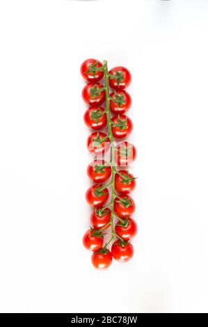 Italian red tomatoes close up food with pasta, basil leafs, cheese, isolated on white background - Top view Stock Photo