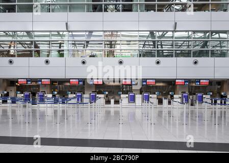 Duesseldorf, Germany. 03rd Apr, 2020. Empty of people is the main hall with the check-in counters of Düsseldorf Airport at the beginning of the Easter holidays. Credit: Marcel Kusch/dpa/Alamy Live News Stock Photo
