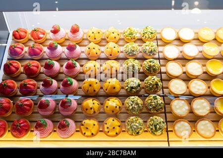 Top view image of fruit pies being displayed on a transparent storage. Stock Photo