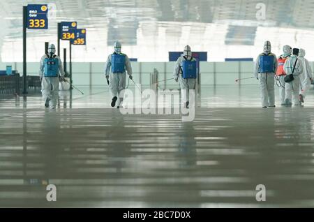 Wuhan, China. 03rd Apr, 2020. Firefighters conduct disinfection at the Wuhan Tianhe International Airport in Wuhan, central China's Hubei Province, April 3, 2020. Wuhan, the Chinese city hardest hit by the novel coronavirus outbreak, conducted disinfection Friday on the local airport as operations will soon resume on April 8 when the city lifts its travel restrictions. Credit: Xinhua/Alamy Live News