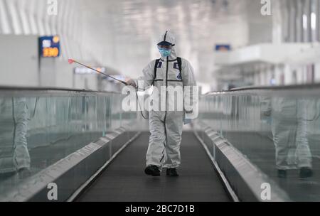 Wuhan, China. 03rd Apr, 2020. A firefighter conducts disinfection at the Wuhan Tianhe International Airport in Wuhan, central China's Hubei Province, April 3, 2020.  Wuhan, the Chinese city hardest hit by the novel coronavirus outbreak, conducted disinfection Friday on the local airport as operations will soon resume on April 8 when the city lifts its travel restrictions. Credit: Xinhua/Alamy Live News