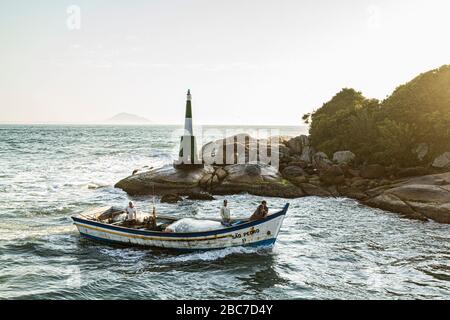 Fishing boat entering Barra da Lagoa Canal. Florianopolis, Santa Catarina, Brazil. Stock Photo