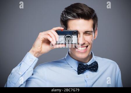 Man with vintage camera Stock Photo