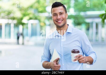 Young man smiling outdoors Stock Photo