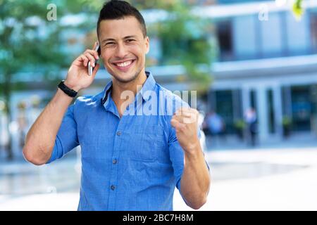Young man using his smartphone Stock Photo