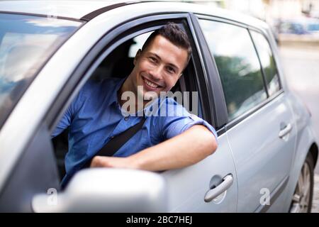 Young man sitting in a car Stock Photo