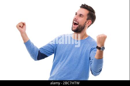 Happy man clenching fists Stock Photo