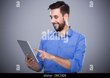 Man holding digital tablet Stock Photo