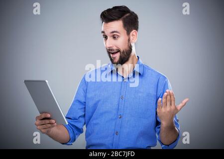 Man holding digital tablet Stock Photo
