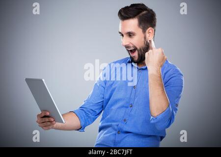 Man holding digital tablet Stock Photo
