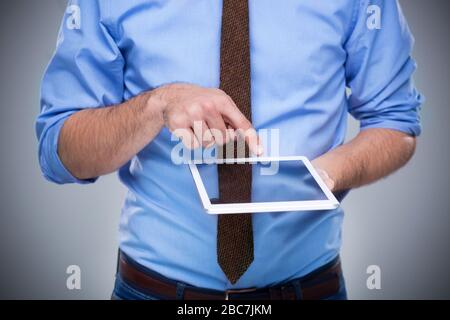 Man holding digital tablet Stock Photo