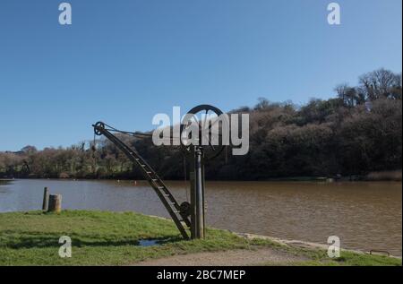 Vintage Metal Hand Operated Crane or Winch on the Quay at Cotehele on the River Tamar in Rural Cornwall, England, UK Stock Photo