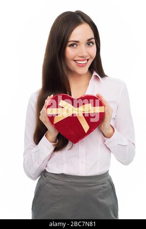 Woman holding heart-shaped box Stock Photo