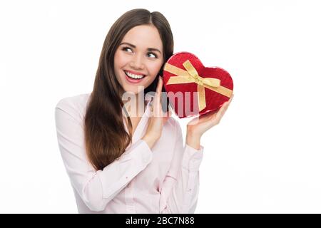 Woman holding heart-shaped box Stock Photo
