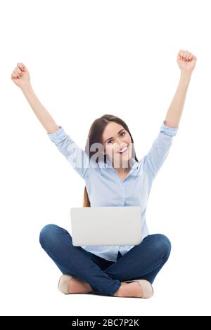 Young woman sitting on white background Stock Photo