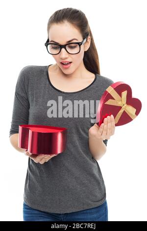 Woman holding heart-shaped box Stock Photo