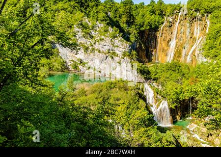 Veliki Slap, the Large or Great Waterfall, flowing into a series of small lakes, at Plitvice Lakes National Park in Croatia, Europe. May 2017. Stock Photo