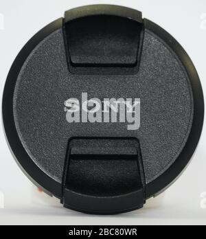 Sony Camera Lens Cap on white background. Branded cap of camera lens named Sony as accessories for those whose hobby in photography. : Udaipur India - Stock Photo