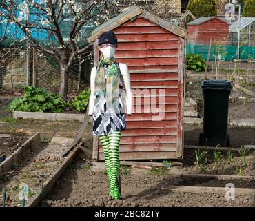 Edinburgh, UK. 3rd Apr 2020. Covid-19 - Restalrig railway path, Edinburgh. Restalrig railway path, Edinburgh, Midlothian, UK. , . Pic shows: In Leith, Edinburgh, even the scarecrows in the allotments are not only stylish but wearing protective masks. Credit: Ian Jacobs/Alamy Live News Stock Photo