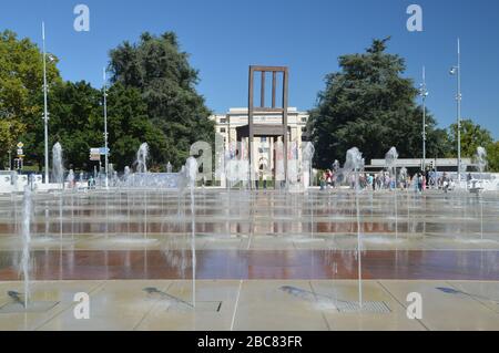 Broken Chair. A work of art that stands near the Palace of Nations in Geneva, Switzerland. It symbolises opposition to land mines and cluster bombs. Stock Photo