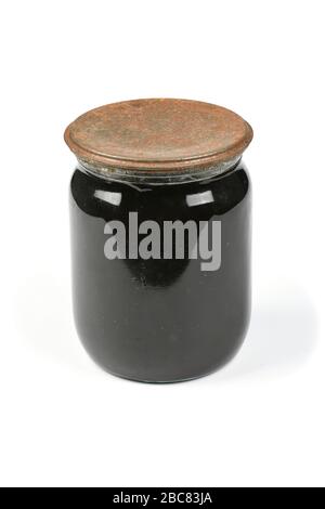 Old glass jar with jam isolated on white background with soft shadow. High resolution photo. Full depth of field. Stock Photo