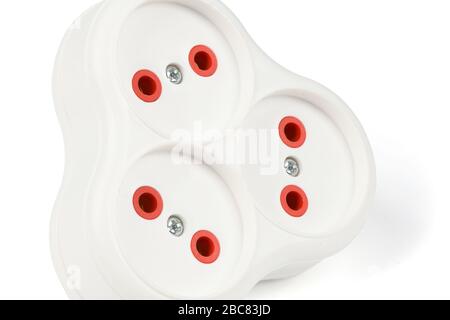 Plastic electrical tee connector with three sockets on a white background. Stock Photo