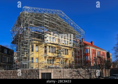 1910s Residential building with scaffolding in Eira,  Helsinki, Finland on a sunny day of spring. April 2020. Stock Photo