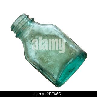 Very old green glass medicine bottle isolated on white. Looks hand blown. Stock Photo