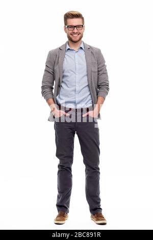 Portrait of young man standing on white background Stock Photo