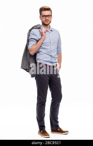 Portrait of young man standing on white background Stock Photo