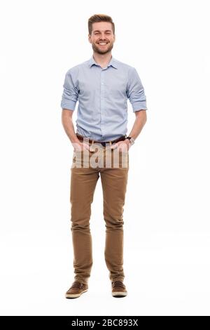 Portrait of young man standing on white background Stock Photo