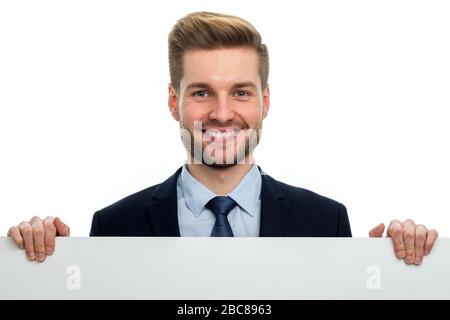 Business man holding white board Stock Photo